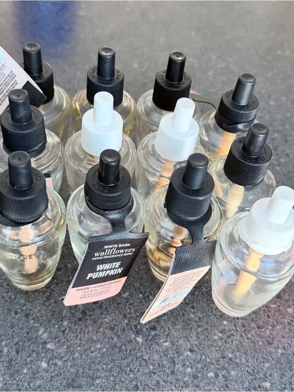 12 Empty wallflower refill bottles